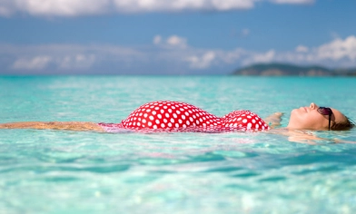 pregnant lady relaxing in the sea