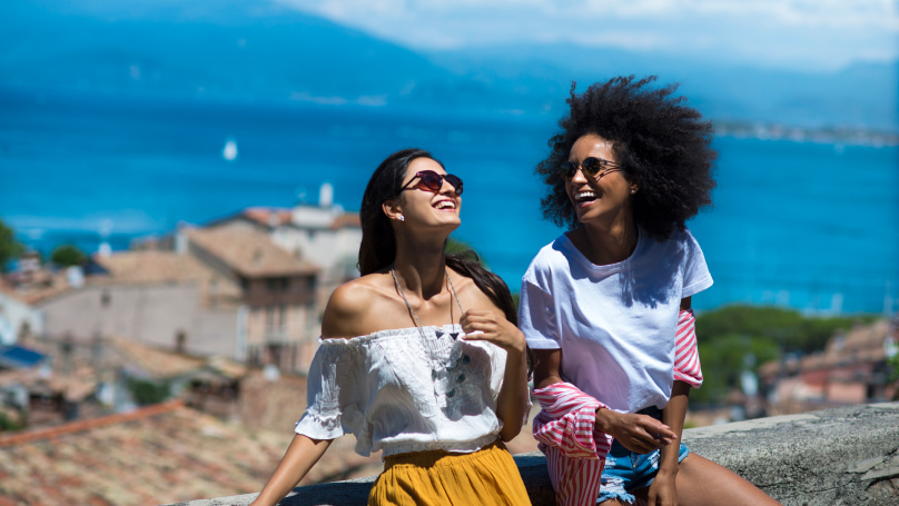 two women smiling and laughing