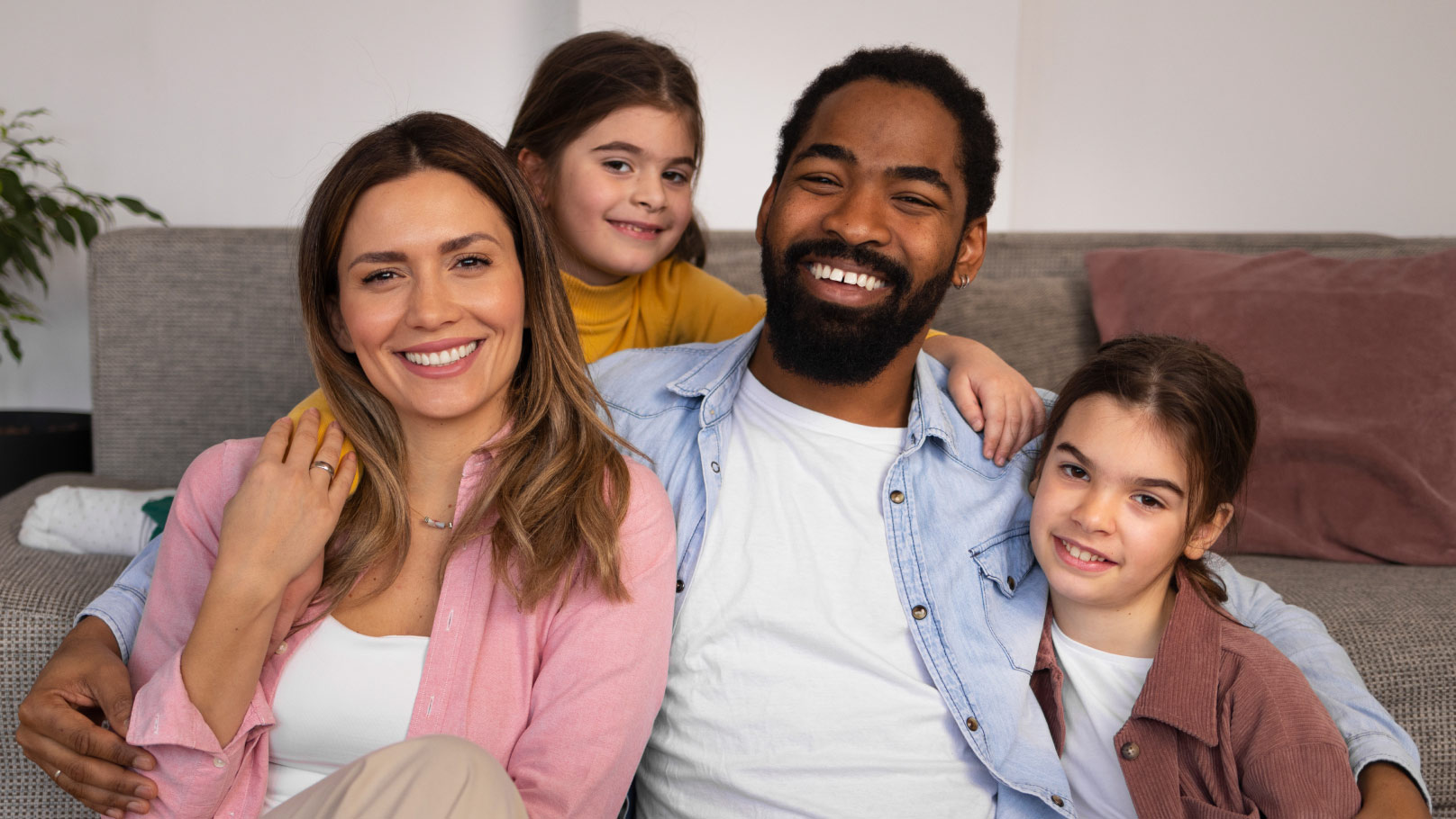 husband and wife with their two kids