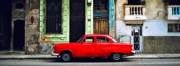 Classic red car parked in Havana street, Cuba