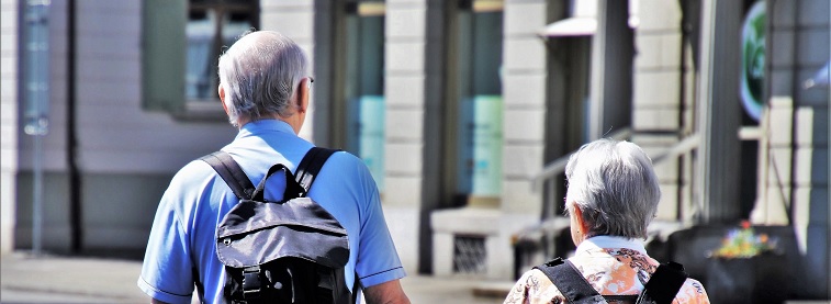 Senior citizens travelling and holding hands